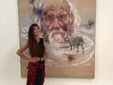 L'artista in posa con una propria opera