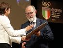 Nell'immagine (ph. Merfephoto - Efrem Zanchettin), Gianuzzi riceve dal questore di Asti Marina di Donato l’onorificenza della Stella Al Merito Sportivo durante la serata dei Premi Coni 2024