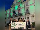 Il Municipio di Asti illuminato di "verde Aisla" in una precedente edizione della Giornata