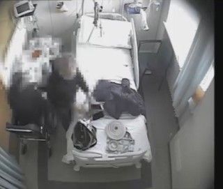 Un frame delle riprese effettuate dai Carabinieri dei Nas nella stanza di ospedale del Santo Spirito di Bra