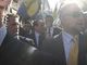Berlusconi durante la sua visita ad Asti con la scorta e la Digos