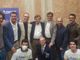 Federico Lucia (accosciato al centro) con Fausto Fogliati, Marco Demaria e altri esponenti di Azione in occasione della visita del leader Carlo Calenda ad Asti