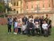 La signora Liliana siede acconto a don Vittorio Croce, ex vicario generale della Diocesi di Asti, durante una visita di una scolaresca a Villa Badoglio.