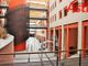 Un corridoio arancione dell'ospedale di Asti Cardinal Massaia