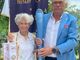 Tiziana Nasi con Maurizio Mela; tra loro la fiaccola dei Giochi Paralimpici di Torino 2006