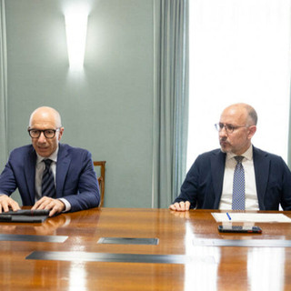 Rasero e l'AD del gruppo bancario Roberto Fiorini (alla sua destra), ritratti nel corso di un precedente incontro istituzionale