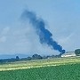 La nube di fumo in lontananza del trattore in fiamme a Moretta