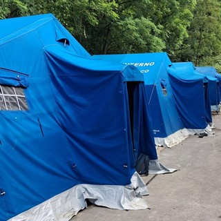 Protezione Civile ANC in azione a Costigliole d'Asti: montate le tende per il campo estivo sotto il sole di giugno